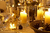Burning candles on Christmas table