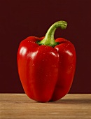 A red pepper on wood