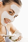 Young woman with facial mask