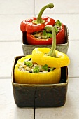 Red & yellow peppers stuffed with rice, celery, pine nuts