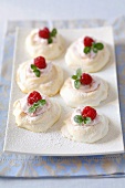Meringues with strawberry cream and fresh raspberries