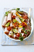 Ham and salami platter with garnish