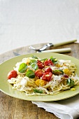 Spaghetti with tomatoes, basil and grated mozzarella