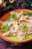 Ravioli with cheese filling and basil