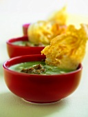 Three bowls of spinach soup