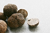 Black truffles (Chinese truffles) whole and halved