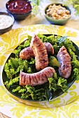 Sausages on a bed of herbs