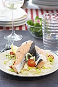Poached salmon fillet with leeks