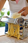 Making tagliatelle with a pasta maker
