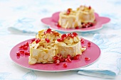 Baked goat's cheese with almonds and pomegranate seeds