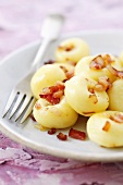 Kluski slaskie with bacon (Potato dumplings, Silesia)