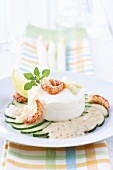 Asparagus mousse with scampi on cucumber salad