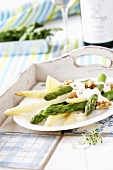White and green asparagus with sour cream and walnuts