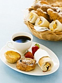 Pastries and bread rolls with coffee