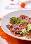 Beef carpaccio with rocket, capers, olive oil