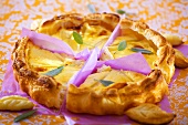 Cheese tart with sage leaves