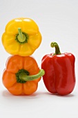 Three peppers, two stacked, one standing