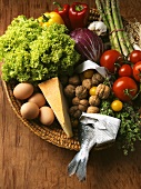 Vegetables, eggs, cheese and nuts in basket