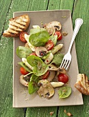 Spinach, asparagus, mushroom and cherry tomato salad