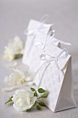 Paper bags with white roses