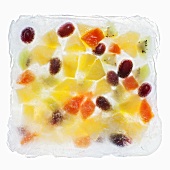 Fruit salad frozen in a block of ice