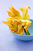 Courgette flowers in a small bowl