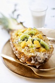 Pineapple with kiwi fruit and grated coconut