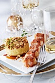 Fried bacon-wrapped scallop skewer with mashed potato