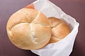 Two bread rolls in a paper bag