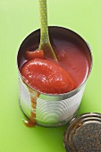 Peeled tomatoes in tomato juice in a tin