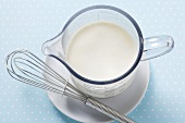 Cream in a measuring jug
