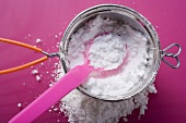 Icing sugar in a sieve