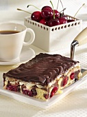 Danube Waves Cake on cake slice, cup of coffee