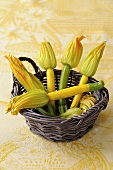 Courgettes with flowers in a basket