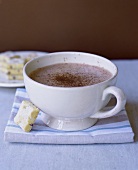 A cup of hot chocolate with shortbread