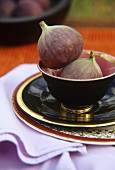 Two figs in a bowl
