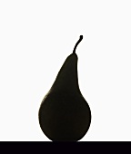 A black pear against a white background