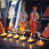 Religious paintings by candlelight (India)