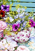 Anemones and delphiniums in a teapot