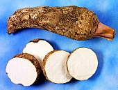 Taro root (Colocasia esculenta), whole and sliced
