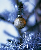 Christmas bauble with the words 'Merry Christmas' on tree