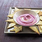 Beetroot dip with hummus and tortilla chips