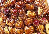Profiteroles with caramel sauce and cherries (detail)