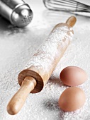 Still life with rolling pin, flour, eggs
