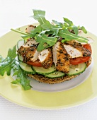 Pesto chicken, cucumber and rocket on wholemeal bagel