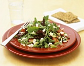 Mixed salad leaves with feta and tomatoes