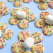 White gems (white chocolate buttons with sprinkles) forming flowers