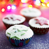 Iced fairy cakes with marzipan stars for Christmas