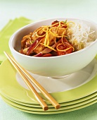 Sweet and sour chicken on rice noodles