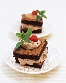 Small chocolate sponge cakes filled with raspberry cream